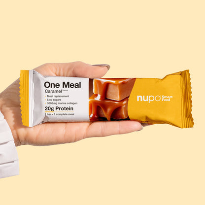 Nupo One Meal Bar Caramel bar in hand