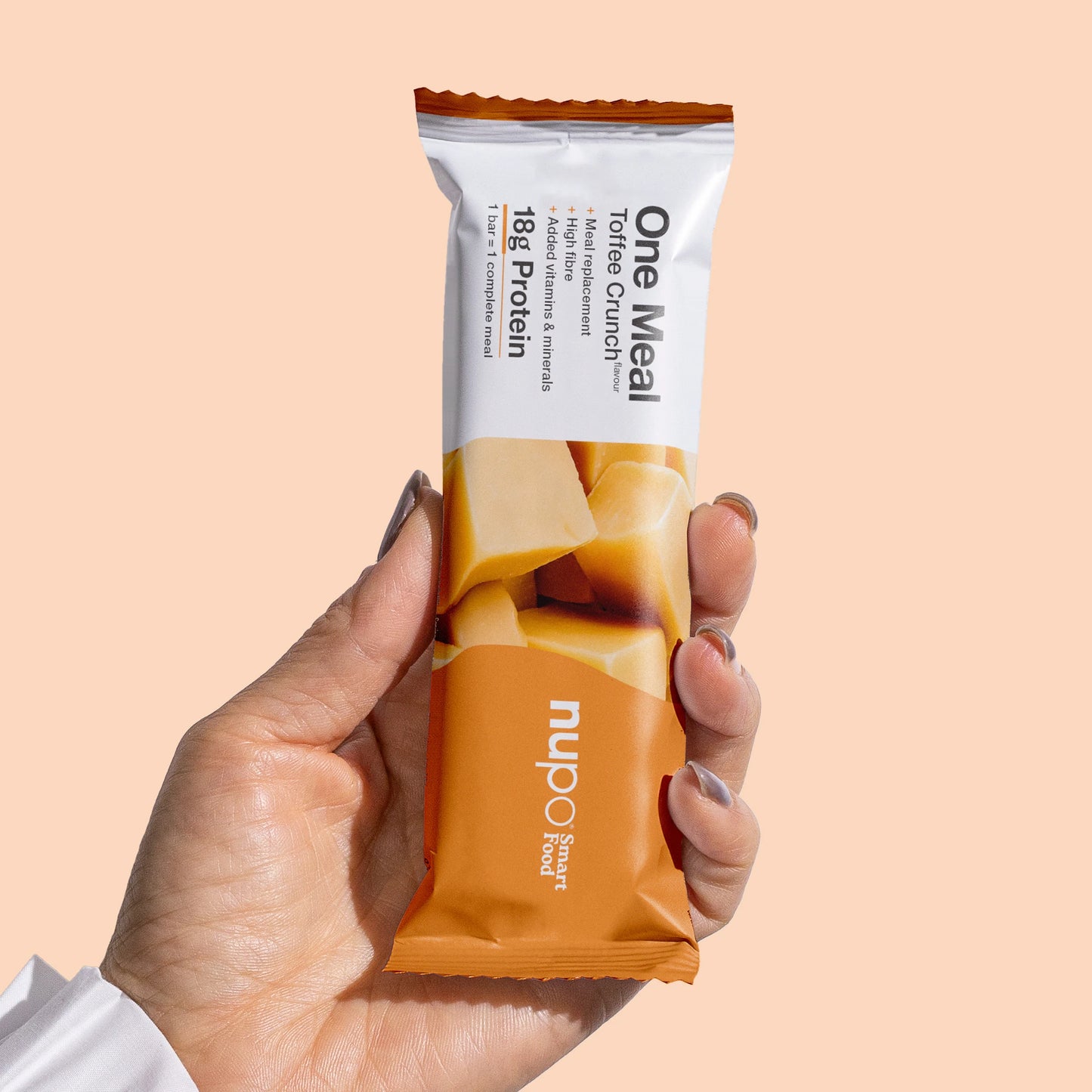 Nupo One Meal Toffee Crunch bar in hand – easy on-the-go meal replacement